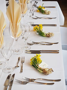 silver utensil on white table setting thumbnail