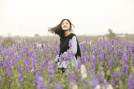 Woman With Black and White Long-sleeved Top on Garden thumbnail