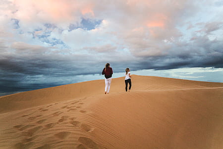 man and woman running on sand thumbnail
