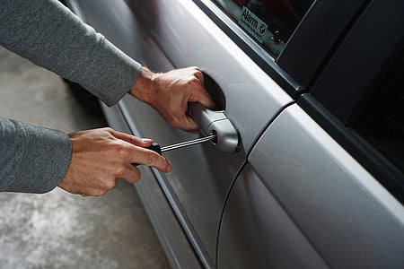 person unlocking car door handle thumbnail