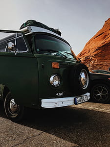 green car beside black car thumbnail