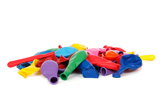 pile of multi-colored deflated balloons thumbnail