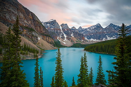 lake surrounded by brown and blue rocky mountain thumbnail