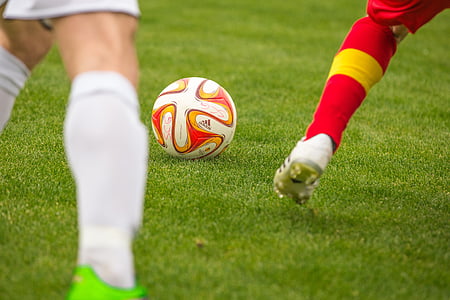 two person playing soccer at field thumbnail