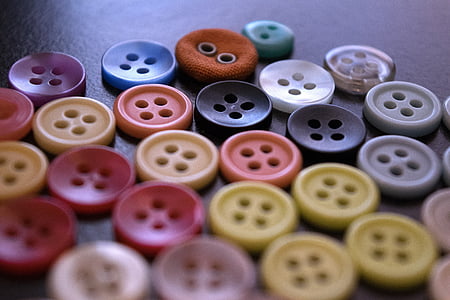 macro photography of assorted buttons thumbnail