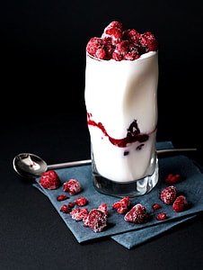white liquid filled drinking glass with raspberry lot thumbnail