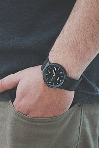 person wearing black watch thumbnail