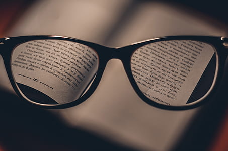 view of book from wayfarer eyeglasses thumbnail