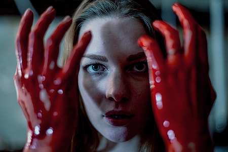 Woman with hands covered in blood thumbnail