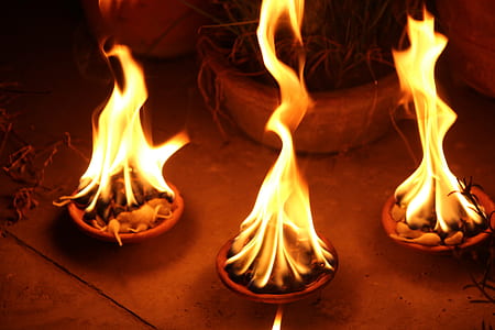 three lighted fire pits thumbnail