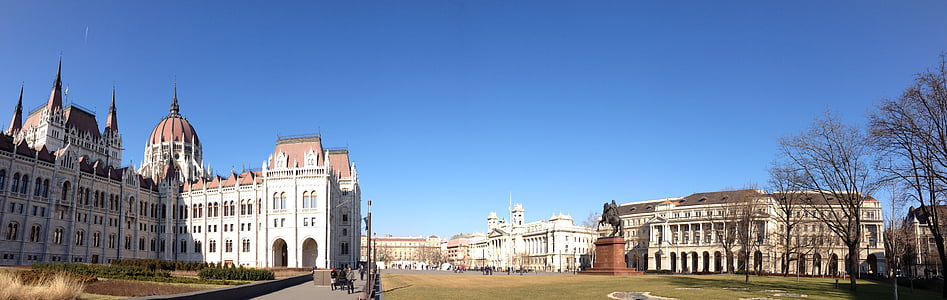white and brown concrete buildings under blue clear sky during daytime thumbnail