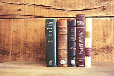 five books collection on gray cement surface thumbnail