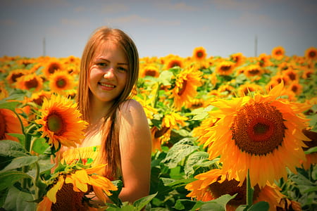 woman standing on sunflower field thumbnail