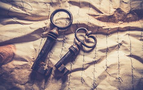 two skeleton keys on brown paper thumbnail