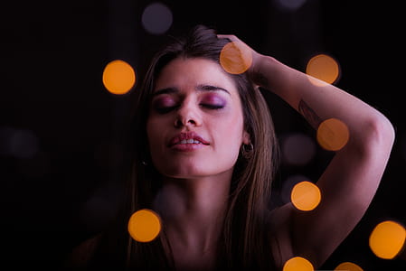 woman holding her hair thumbnail