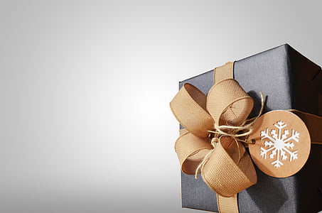 square black gift box with brown bow thumbnail