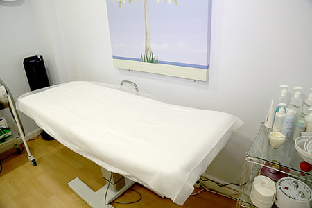 white gatch bed beside painting thumbnail