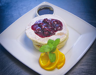 cooked dish topped with syrup on square white ceramic plate thumbnail