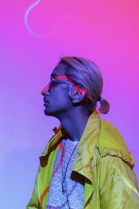 portrait photo of man in yellow jacket and sunglasses thumbnail
