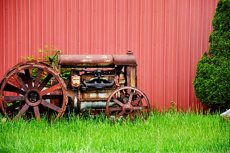 brown tractor on green grass thumbnail