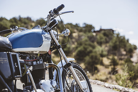 selective focus photography of white standard motorcycle thumbnail