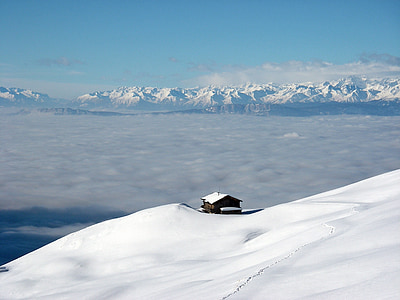 brown house at the edge of the snowy cliff thumbnail