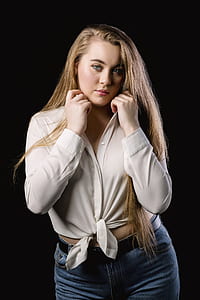 woman wearing white long-sleeved shirt and blue denim bottoms thumbnail