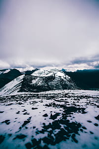 ground covered with snow under white sky thumbnail