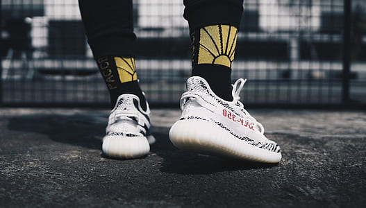 person wearing zebra adidas Yeezy Boost 350 V2 thumbnail