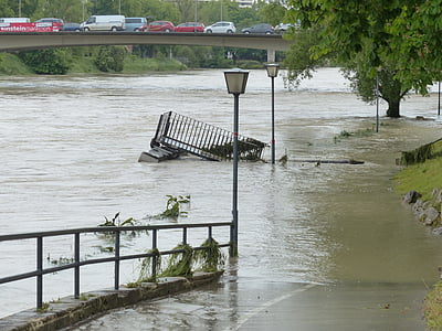 black metal cage stocked on flooded road during daytime thumbnail