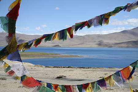 body of water near mountain thumbnail