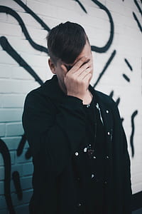 man covering his face thumbnail
