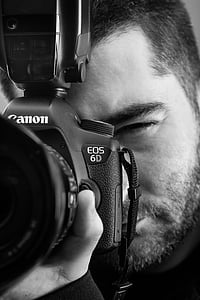 grayscale photo of a man using Canon EOS 6D thumbnail