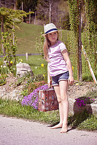 girl wearing purple T-shirt during daytime thumbnail