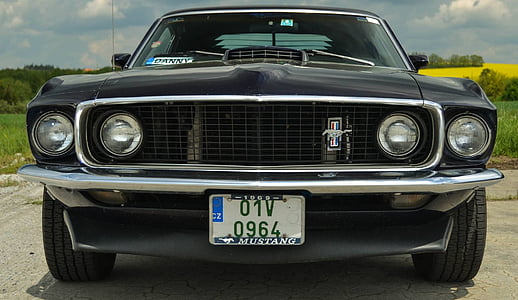 black Ford Mustang on road at daytime thumbnail