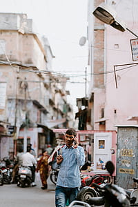 man having phone call walking on street thumbnail