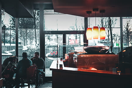two men and women sitting on chairs thumbnail