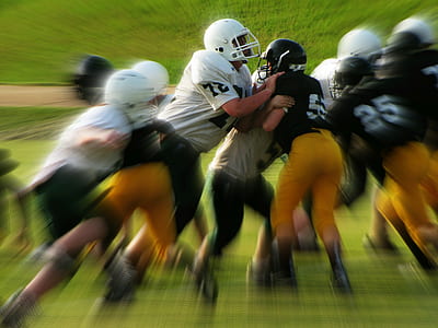 Men in White and Black Playing Football thumbnail