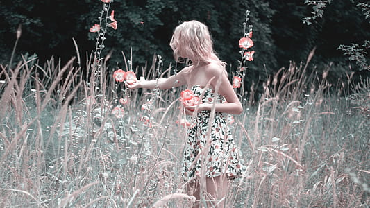 woman in black and white floral dress thumbnail