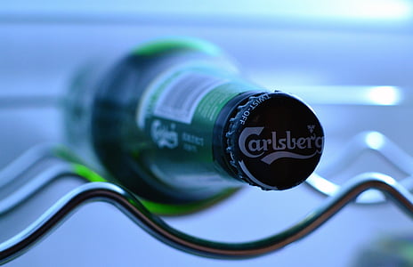 selective focus photography of Carlsbera glass bottle thumbnail