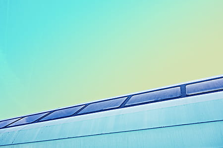 white and black building at daytime thumbnail