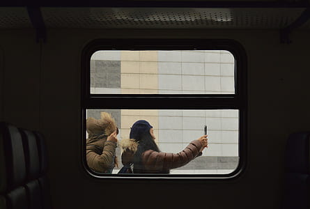 two person near white building thumbnail