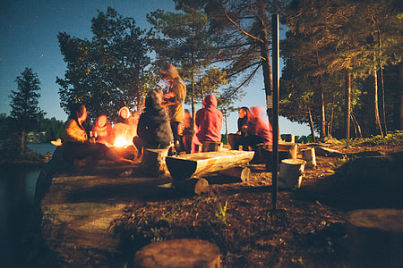 group of people on camp talking to each other thumbnail