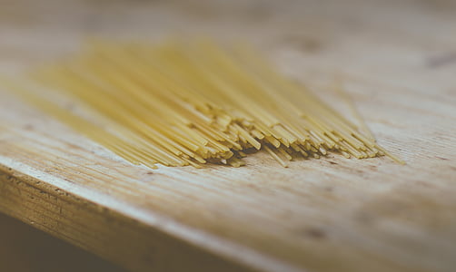spaghetti pasta on brown wooden surface thumbnail