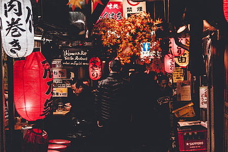 man standing between of night market thumbnail