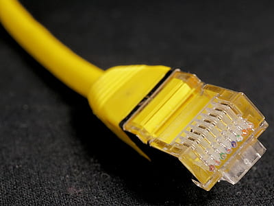 yellow ethernet cable on black textile thumbnail
