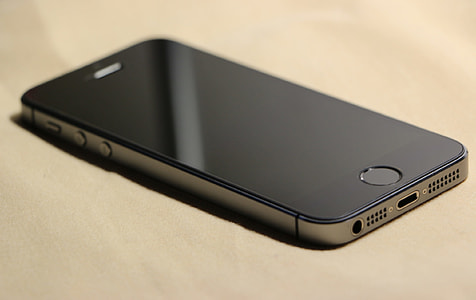 space gray iPhone 5s on brown surface thumbnail