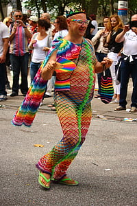 man wearing multicolored fishnet suit on street thumbnail