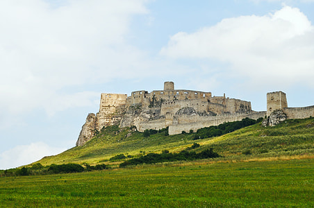 brown castle under cumulus clouds and blue calm sky thumbnail