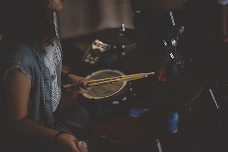 woman playing drum set thumbnail